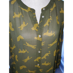 Go Green with this duck tail blouse with small gold cheetah pictures.